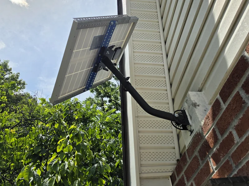 Shed solar card image showing hardware for a small outdoor power system.